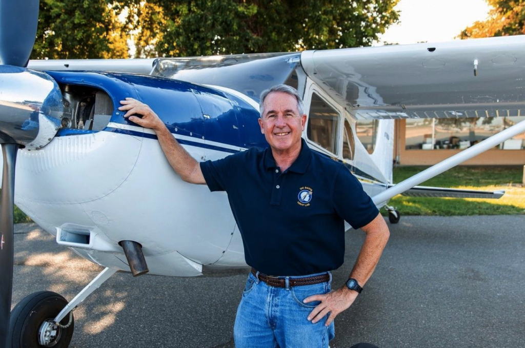 Dr Stephen Robinson with airplane