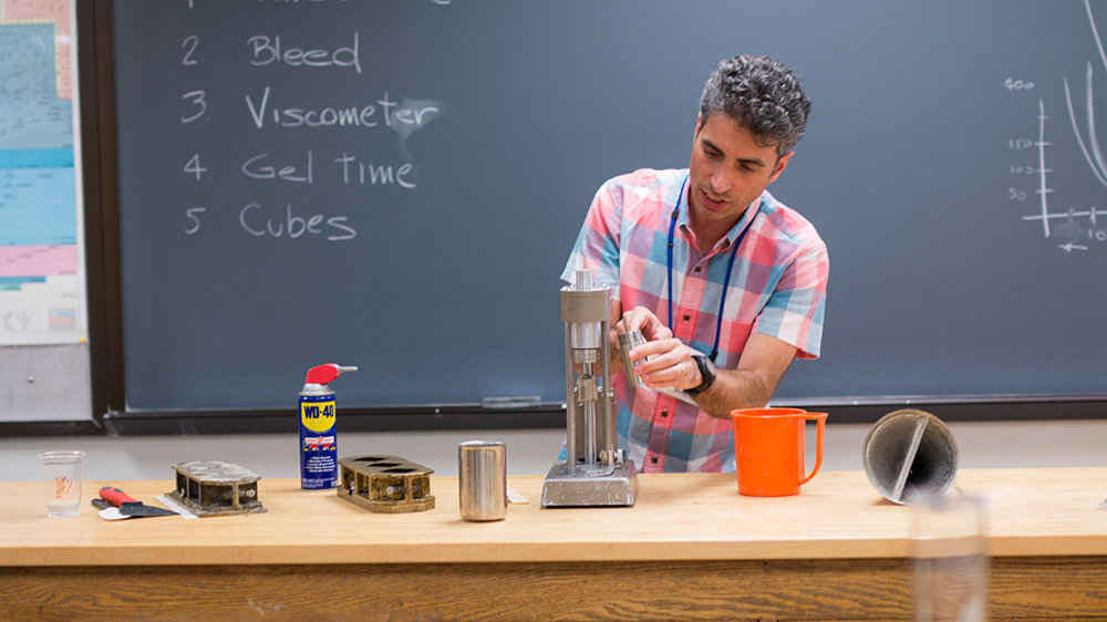 Teacher conducting lab experiment during a course